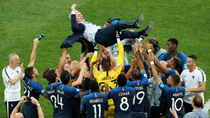 Soccer Football - World Cup - Final - France v Croatia - Luzhniki Stadium, Moscow, Russia - July 15, 2018 France coach Didier Deschamps is thrown into the air by his players as they celebrate after winning the World Cup REUTERS/Maxim Shemetov