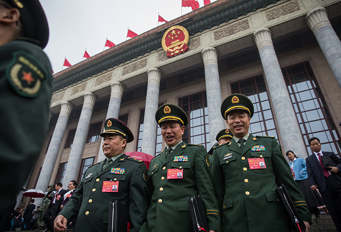 epa06272484 Chinese military delegates leave after the opening ceremony of the 19th National Congress of the Communist Party of China (CPC) at the Great Hall of the People (GHOP) in Beijing, China, 18 October 2017. China holds the 19th Congress of the Communist Party of China, the country's most important political event where the party's leadership is chosen and plans are made for the next five years. Xi Jinping is expected to remain as the General Secretary of the Communist Party of China for another five-year term. EPA/ROMAN PILIPEY