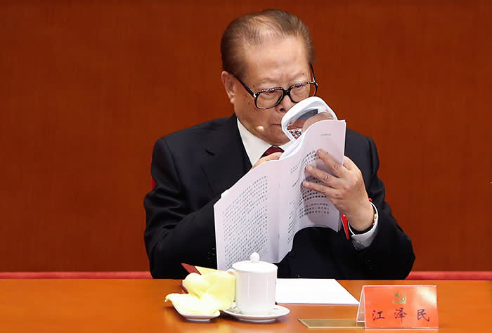BEIJING, CHINA - OCTOBER 18: China's former president Jiang Zemin reads a document while he attends the opening session of the Chinese Communist Party's Congress at the Great Hall of the People on October 18, 2017 in Beijing, China. The 19th CPC National Congress is going to run 7 days and a new central committee of CPC will be produced. (Photo by Lintao Zhang/Getty Images)