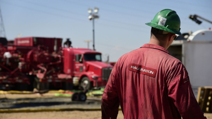 A Halliburton Co. worker walks through an Anadarko Petroleum Corp. hydraulic fracturing (fracking) site north of Dacono, Colorado, U.S., on Tuesday, Aug. 12, 2014. U.S. crude oil inventories rose by 1.4 million barrels in the week ended Aug. 8, to 367 million, compared with the consensus-estimated draw of 1.6 million. Photographer: Jamie Schwaberow/Bloomberg