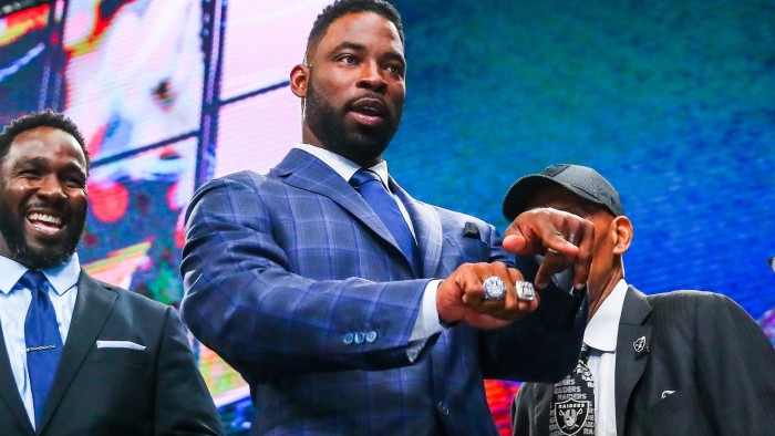 ARLINGTON, TX - APRIL 27: Former New York Giant Justin Tuck shows fans his two Super Bowl Rings during the second round of the 2018 NFL Draft on April 27, 2018, at AT