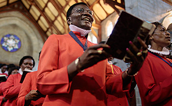 Kenyan women sing in prayers at a service attended by the Archbishop of Canterbury Justin Welby at the All Saints' Cathedral in Nairobi, Kenya, 20 October 2013