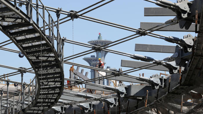 Workers are seen at the construction site of the National Speed Skating Oval, one of the venues for the 2022 Winter Olympics, in Beijing, China May 21, 2019. Picture taken May 21, 2019. China Daily via REUTERS ATTENTION EDITORS - THIS IMAGE WAS PROVIDED BY A THIRD PARTY. CHINA OUT. NO COMMERCIAL OR EDITORIAL SALES IN CHINA. - RC1E36673940