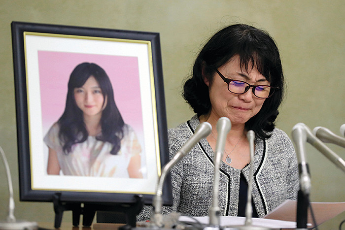 TOKYO, JAPAN - JANUARY 20: Yukimi Takahashi, whose daughter Matsuri killed herself in 2015 due to overwork, speaks to reporters about the agreement she reached with Dentsu Inc. on January 20, 2017 in Tokyo, Japan. Takahashi joined Dentsu in April 2015 after graduating from the Faculty of Letters of the University of Tokyo. On December 25 that year, she killed herself in a dormitory for the company's female employees. She was just 24 years old. (Photo by The Asahi Shimbun via Getty Images)
