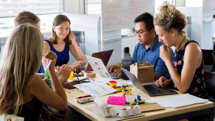 KWP119 Millennials brainstorming in a modern office
