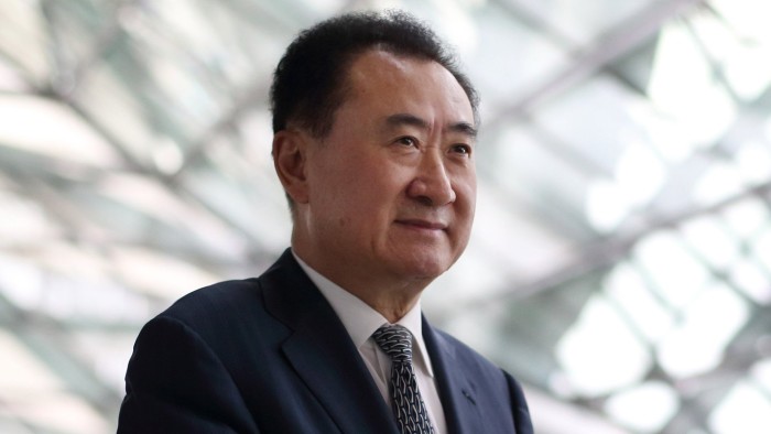 Billionaire Wang Jianlin, chairman and president of Dalian Wanda Group, poses for a portrait at the World Economic Forum Annual Meeting Of The New Champions in Dalian, China, on Wednesday, Sept. 11, 2013. Wang, China's richest man and owner of the country's biggest commercial land developer, said he has hired two investment banks to buy hotel management companies, mostly in the U.S. Photographer: Tomohiro Ohsumi/Bloomberg