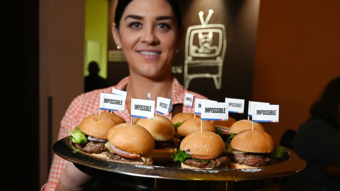 The Impossible Burger 2.0, the new and improved version of the company's plant-based vegan burger that tastes like real beef is introduced at a press event during CES 2019 in Las Vegas, Nevada on January 7, 2019. - The updated version can be cooked on a grill and has a better flavor and lowered cholesterol, fat and calories than the original. &quot;Unlike the cow, we get better at making meat every single day,&quot; CEO of Impossible Foods CEO Pat Brown. (Photo by Robyn Beck / AFP)ROBYN BECK/AFP/Getty Images