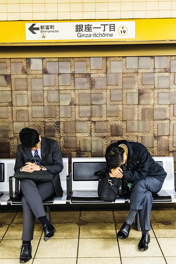 WAB0GC Japan, Honshu, Tokyo, Sleeping Passengers Waiting for Train on Subway Station, 30076275