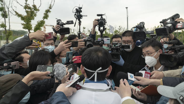 Wang Xinghuan, president of the emergency field hospital Leishenshan in Wuhan, talks to the media on April 14 after the final four patients in its intensive care unit tested negative for coronavirus.