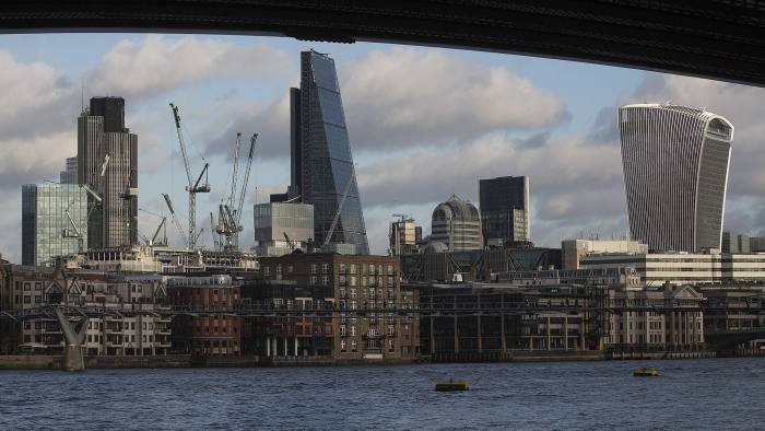 Construction cranes stand above building sites in the City Of London, near Tower 42, left, the Leadenhall building, also known as the "Cheesegrater," center, and 20 Fenchurch Street, also known as the "Walkie-Talkie," right, beyond the north bank of the River Thames in London, U.K., on Monday, Dec. 8, 2014. Reports this week will show U.K. industrial and manufacturing production grew last month and construction increased in October, further highlighting the resilience of the U.K. economy, according to separate surveys. Photographer: Simon Dawson/Bloomberg