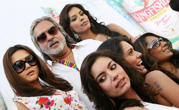Vijay Mallya poses with actresses and models at the launch of his Kingfisher calendar in 2007