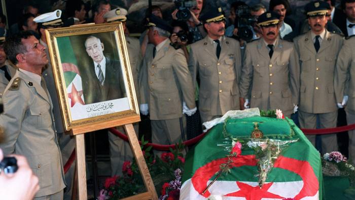 Algerian army officers gather behind the coffin of Algerian President Mohamed Boudiaf 01 July 1992 in Algiers during funeral rites. The Algerian head of State was assassinated by gunmen 29 June in the southern Algerian town of Annaba. (FILM) AFP PHOTO DURAND/SENNA (Photo credit should read ANDRE DURAND/AFP/Getty Images)