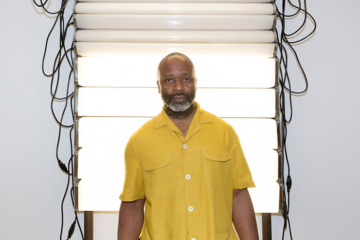 Theaster Gates in front of his work 'Bathroom Believer' (2018)