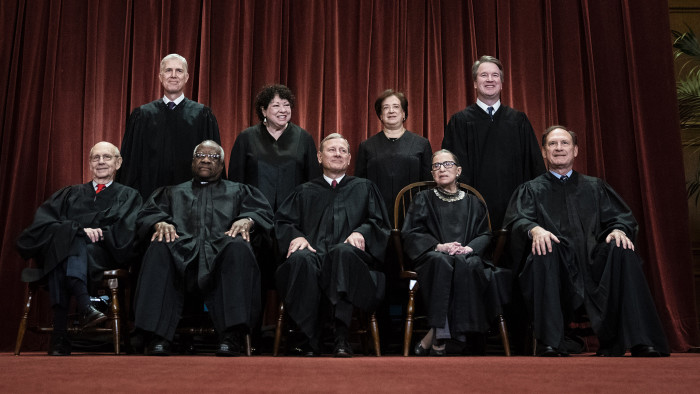 WASHINGTON, DC - NOVEMBER 30 : Justices of the United States Supreme Court sit for their official group photo at the Supreme Court on Friday, Nov. 30, 2018 in Washington, DC. Seated from left, Associate Justice Stephen Breyer, Associate Justice Clarence Thomas, Chief Justice of the United States John G. Roberts, Associate Justice Ruth Bader Ginsburg and Associate Justice Samuel Alito, Jr.. Standing from left, Associate Justice Neil Gorsuch, Associate Justice Sonia Sotomayor, Associate Justice Elena Kagan and Associate Justice Brett M. Kavanaugh. (Photo by Jabin Botsford/The Washington Post via Getty Images)