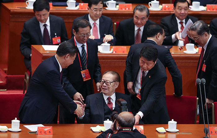 BEIJING, CHINA - OCTOBER 18: Chinese President Xi Jinping (L) shake hands China's former president Jiang Zemin (R) at the opening session of the Chinese Communist Party's Congress at the Great Hall of the People on October 18, 2017 in Beijing, China. The 19th Communist Party Congress will convene from October 18-24. (Photo by Lintao Zhang/Getty Images)