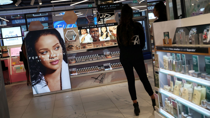 A woman looks at products on display for sale at a Boots store in London, Britain June 26, 2019. REUTERS/Hannah McKay