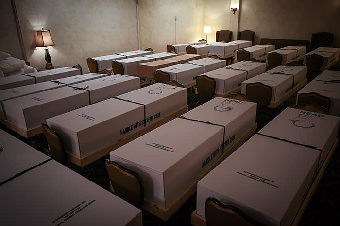 Coffins of people who have died from Covid-19 lined up in a funeral home in Queens, New York. Recent estimates suggest 135,000 people will die by late July