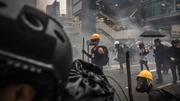 Mandatory Credit: Photo by ROMAN PILIPEY/EPA-EFE/Shutterstock (10371693z) Protesters wearing gas masks in action agains the police during an anti-government rally in Tsuen Wan, in Hong Kong, China, 25 August 2019. The protests were triggered by an extradition bill to China in June, now suspended, and evolved into a wider anti-government movement with no end in sight. An anti-government rally in Kwai Fung and Tsuen Wan in Hong Kong, China - 25 Aug 2019