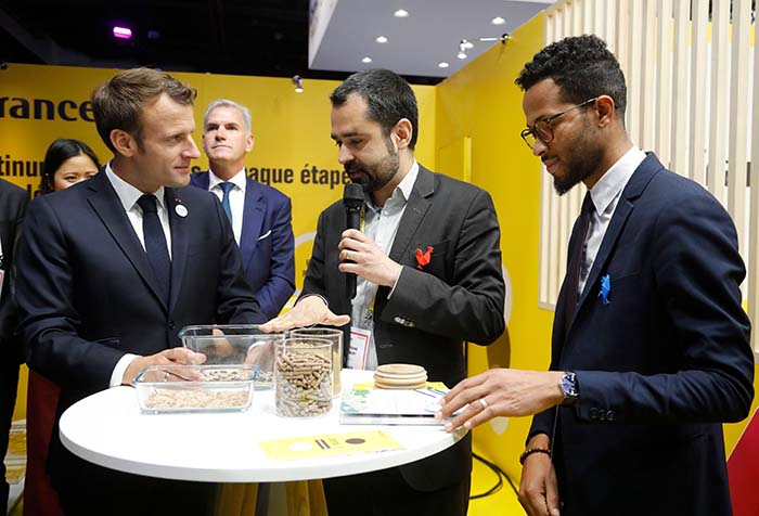 French President Emmanuel Macron (L) listens to CEO of Ynsect Antoine Hubert (C) during a visit to the Vivatech French tech trade show at Paris Expo in Paris on May 16, 2019. (Photo by Michel Euler / POOL / AFP) (Photo credit should read MICHEL EULER/AFP via Getty Images)