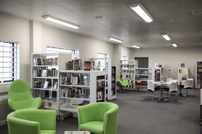 HMP Berwyn's library. Katie Lomas, national chair of the trade union for probation officers, said HMP Berwyn had a "really positive aim" to focus on rehabilitation