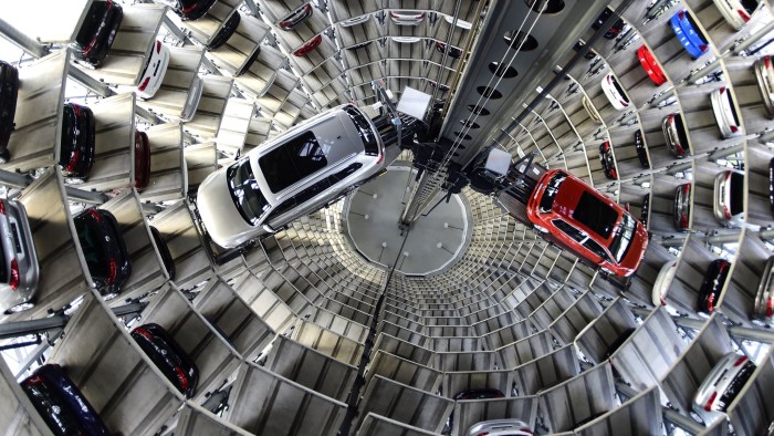 WOLFSBURG, GERMANY - MARCH 10: A brand new Volkswagen Passat and Golf 7 car stands stored in a tower at the Volkswagen Autostadt complex near the Volkswagen factory on March 10, 2015 in Wolfsburg, Germany. Volkswagen is Germany's biggest car maker and is scheduled to announce financial results for 2014 later this week. Customers who buy a new Volkswagen in Germany have the option of coming to the Autostadt customer service center in person to pick up their new car. (Photo by Alexander Koerner/Getty Images)