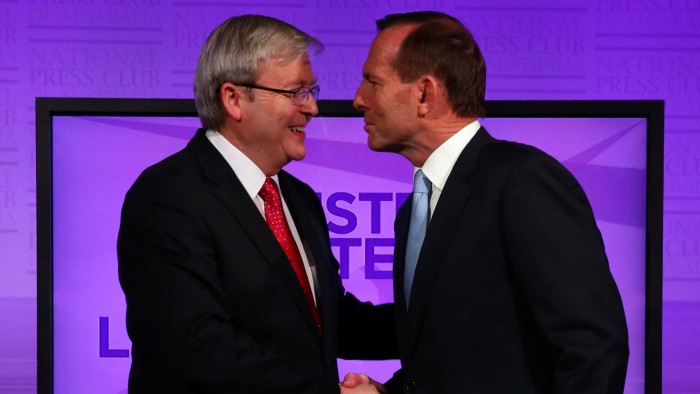 Australian Prime Minister Kevin Rudd talks with conservative opposition leader Tony Abbott