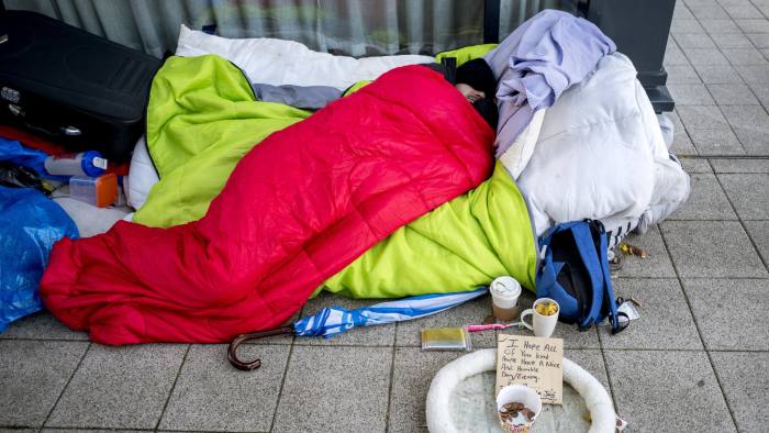 A homeless person is seen sleeping rough in Milton Keynes town centre on November 24, 2017.
