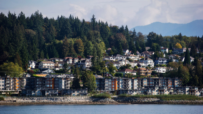 Residential condo buildings and single family houses are seen above Burrard Inlet in North Vancouver, British Columbia, Canada, on Wednesday, Sept. 19, 2018. U.S. Trade Representative Robert Lighthizer and Canadian Foreign Minister Chrystia Freeland met Thursday in Washington to negotiate Nafta talks, but no agreement was reached. Photographer: Darryl Dyck/Bloomberg via Getty Images