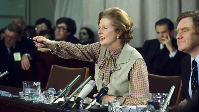 LONDON, UNITED KINGDOM - circa 1980: Prime Minister Margaret Thatcher speaks beside her Press Secretary Bernard Ingham (R) at a political conference during the early 1980s in London, England. (Photo by Tim Graham/Getty Images)