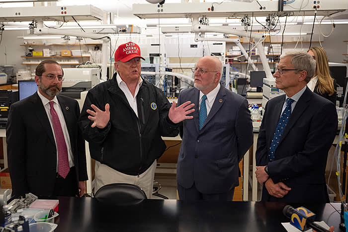 Donald Trump at the Centers for Disease Control and Prevention in Atlanta on March 6 with, from left, Alex Azar, secretary of health and human services, Robert Redfield, CDC director, and Steve Monroe, associate director for laboratory science and safety at the CDC