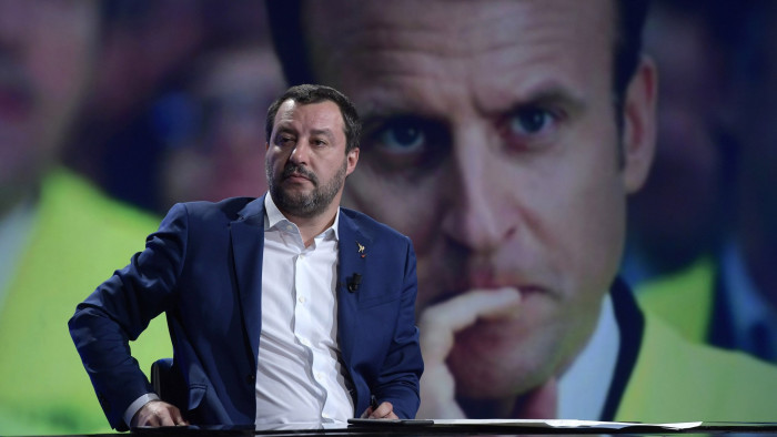 Italy, Rome - December 9, 2018 The Interior Minister Matteo Salvini guest at ‚Äö‚Äômezz‚Äôora‚Äò RAI 3 TV talk show Emmanuel Macron on the screen