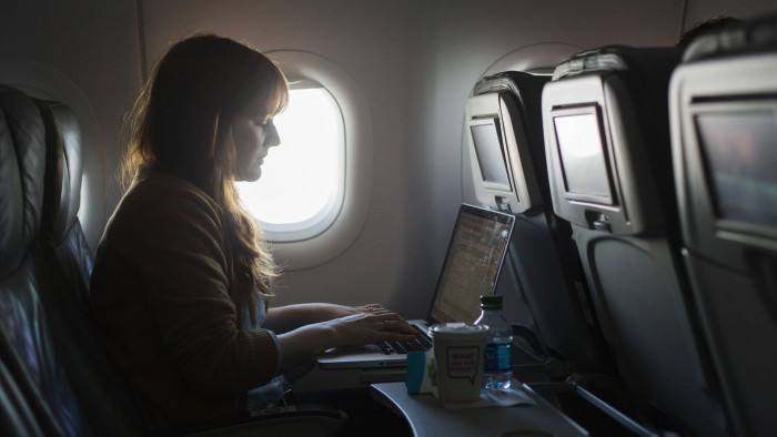 Ms Wolf-at-the-Door flips open the lid of her laptop the moment we are airborne and hammers away at her keyboard throughout the entire flight