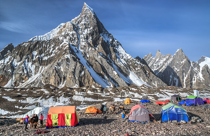 View of Concordia campsite on Baltoro glacier, beneath the impressive Mitre Peak (6,010 m / 19,720 ft), a mountain in the Karakoram range, located in Central Karakoram National Park (CKNP), Gilgit-Baltistan region, northern Pakistan.