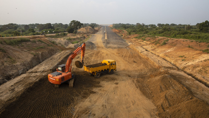HAMBANTOTA, SRI LANKA - NOVEMBER 16: The extension of the Southern Expressway from Matara to Hambantota continues under construction on November 16, 2018 near Hambantota, Sri Lanka. Extension of the Southern Expressway in Sri Lanka is one of the major infrastructure projects built by Chinese and Sri Lankan workers under the framework of the Belt and Road Initiative. The 96-kilometer project was undertaken by three Chinese companies, with a $1.9 billion concessional loan from the Export-Import Bank of China. As the political crisis escalates in Sri Lanka, former President Mahinda Rajapaksas return to power in late October has been watched with increasing concern by countries including the U.S., China and India. The re-entry of Rajapaksa could and raise the influence from Beijing and alter the power dynamics around the Indian Ocean. During Rajapaksas 2005-2015 presidency, Sri Lanka saw an influx of Chinese investment and economic support since he relied heavily on China for economic support, military equipment and political cover. While ousted Prime Minister Ranil Wickremesinghe sought to balance relations with New Delhi and Beijing, Rajapaksa made clear his willingness to accept Chinese money even in the face of unreasonable terms while reports from the Central Bank estimated the debt owed to China could be as much as $5 billion and growing every year. Chinese investments paid for a new port, a new airport and new railway on Sri Lankas southern coast, among other projects in Colombo, which forced the government to sell strategic assets to Beijing, such as the Hambantota port, when it wasn't able to meet liabilities. For China, the relation with Sri Lanka ties back thousands of years when it was a stop along the old Silk Road trade routes, as it is now known to be a critical link for its Belt and Road Initiative, which aims to expand trade across 65 countries from the South Pacific through Asia to Africa and Europe. (Photo by Paula Bronstein/Getty Images)