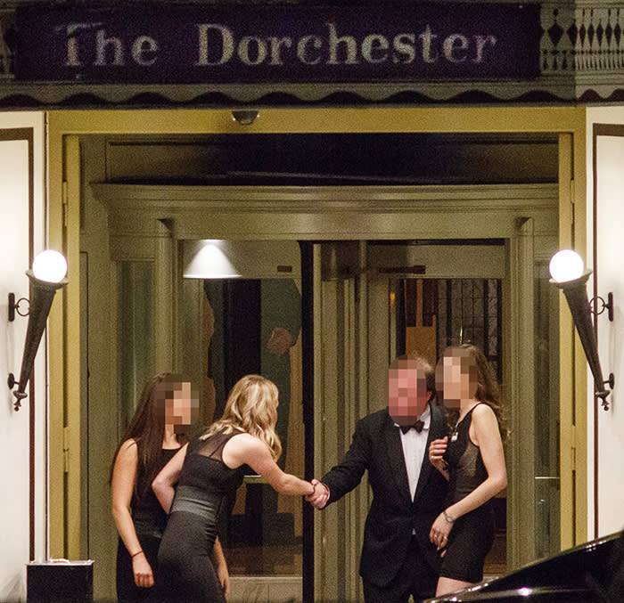 Guests outside The Dorchester Ballroom entrance during the annual Presidents Club Charity Dinner in London on January 18, 2018.