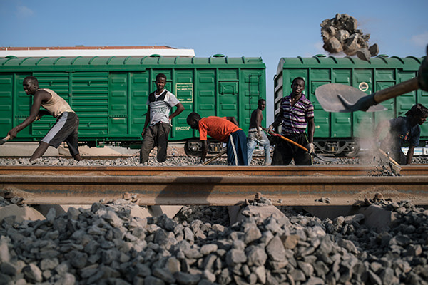 Construction workers building a new railway line linking Djibouti with Ethiopia, one of a number of projects financed by China