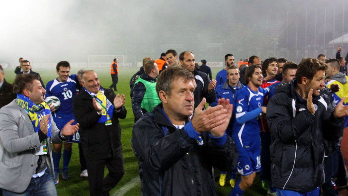 Bosnia and Herzegovina’s coach Safet Susic (centre) celebrates his team’s 1-0 victory over Lithuania in their World Cup qualifier in Kaunas, October 2013