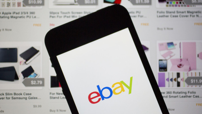 The eBay Inc. logo and application are displayed on a an Apple Inc. iPhone 5s and iPad in this arranged photograph in Washington, D.C., U.S., on Friday, April 25, 2014. EBay Inc. is expected to release earnings figures on April 29. Photographer: Andrew Harrer/Bloomberg