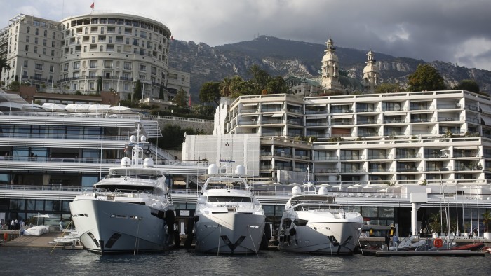 Luxury yachts Blush, left, Thumper, center, and Zozo, built by Sunseeker International Ltd., a unit of Dalian Wanda Group, sit moored in the harbor during the Monaco Yacht Show (MYS) in Monaco, France, on Thursday, Sept. 25, 2014. Over 100 of the world's most luxurious yachts will be displayed in Port Hercules during the 24th MYS which runs from Sept. 24 - 27. Photographer: Simon Dawson/Bloomberg