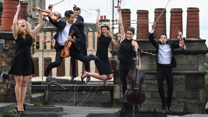 EDINBURGH, SCOTLAND - AUGUST 01: Members of the Catalonian string orchestra Orquestra de Cambra d'Emporda pose on August 1, 2017 in Edinburgh, Scotland. Performing at the Assembly Rooms at this years Edinburgh Festival Fringe, the musicians take on movie soundtracks and pop songs, as well as classical hits, combined with skits and mime. (Photo by Jeff J Mitchell/Getty Images)