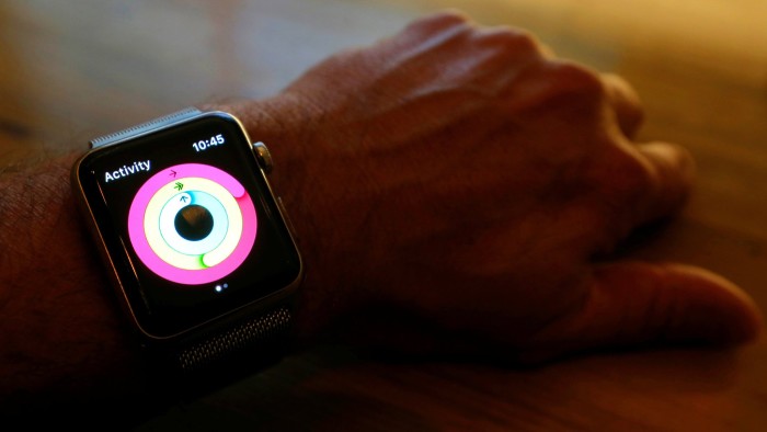 An Apple Watch activity app shows closed rings indicating completed move, exercise and standing goals for the day in this photo illustration taken in Sydney, Australia, September 21, 2017. Picture taken September 21, 2017. REUTERS/Jason Reed/Illustration - RC1CE1C12960