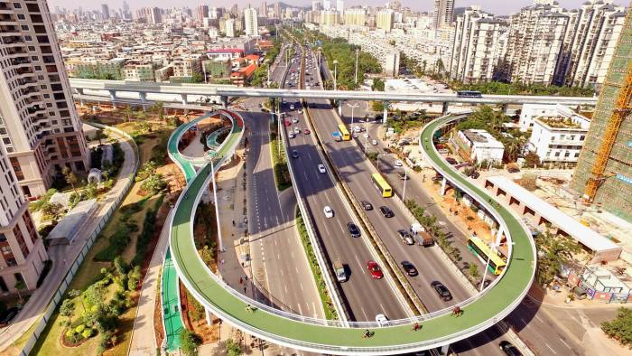 Mandatory Credit: Photo by Xinhua/Shutterstock (8326468a) New cycle route above a motorway New bicycle route built, Xiamen, Fujian Province, China - 09 Feb 2017 According to Xiamen City Public Bicycle Management, the path will be open to all kinds of bikes, including public and private bikes, from 6:30 a.m. to 10:30 p.m. during the month-long trial, in a bid to promote green transport.