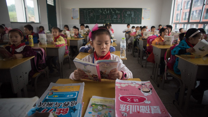 Chinese school children attending class at the Shiniuzhai Puan Center Primary School in Pingjiang County in China's Hunan Province