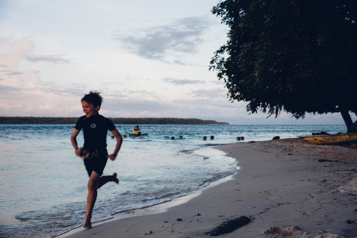 author's son on beach Papua New Guinea credit Sophy Roberts