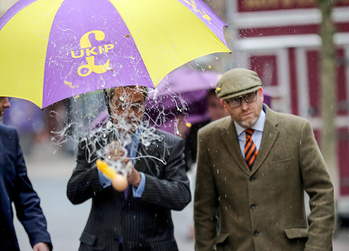 STOKE, ENGLAND - FEBRUARY 06: UKIP leader Paul Nuttall (R) and former Leader Nigel Farage MEP dodge an egg thrown by a youth as they arrive in Stoke-On-Trent for a public meeting this evening on February 6, 2017 in Stoke, England. The Stoke-On-Trent central by-election has been called after sitting Labour MP Tristram Hunt resigned from his seat to be a museum director. The seat has always been a Labour stronghold but will see fierce competition from The United Kingdom Independence Party (UKIP) as they target people who voted for Brexit and the tradtional Labour working classes. (Photo by Christopher Furlong/Getty Images)