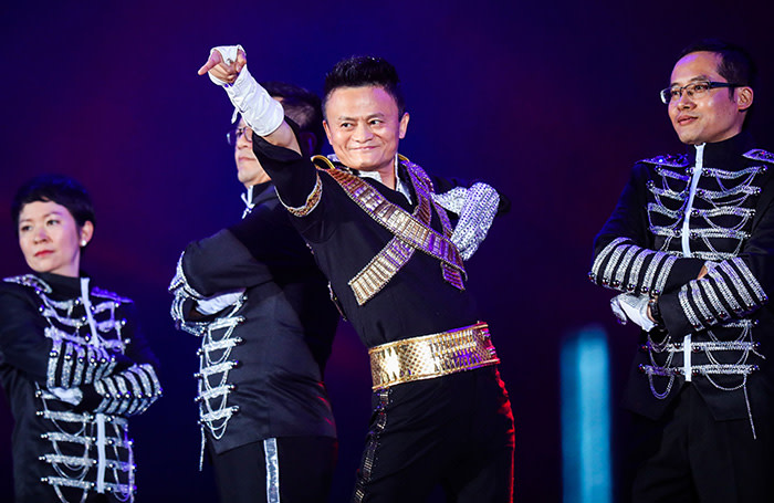 This photo taken on September 8, 2017 shows Jack Ma, chairman of Alibaba group, dancing to a medley of Michael Jackson songs during the Alibaba Annual Party at the Huanglong sports center in Hangzhou in China's eastern Zhejiang province. Ma danced with other Alibaba employees during the party, which was held to celebrate the 18th anniversary of the company's founding. / AFP PHOTO / STR / China OUTSTR/AFP/Getty Images