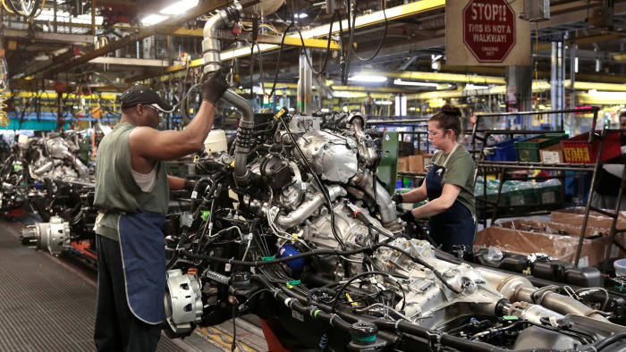 General Motors assembly workers work on the chassis of Chevrolet 2019 heavy-duty pickup trucks at General Motors Flint Assembly Plant in Flint, Michigan, U.S. February 5, 2019. REUTERS/Rebecca Cook - RC1669CAA370