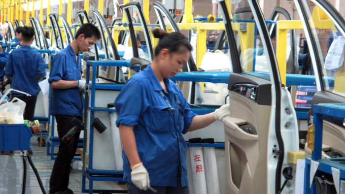 Employees work at a production line inside a factory of Saic GM Wuling, in Liuzhou, Guangxi Zhuang Autonomous Region, China, June 19, 2016. REUTERS/Norihiko Shirouzu/File Photo
