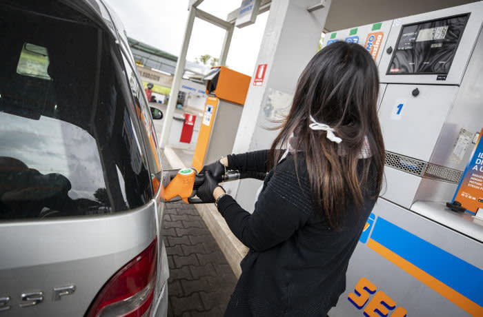 Mandatory Credit: Photo by MASSIMO PERCOSSI/EPA-EFE/Shutterstock (10620049b) A person refuels his car at a service station in Rome, Italy, 21 April 2020. The coronavirus crisis and the collapsed oil price make petrol much cheaper. Coronavirus pandemic in Italy, Rome - 21 Apr 2020