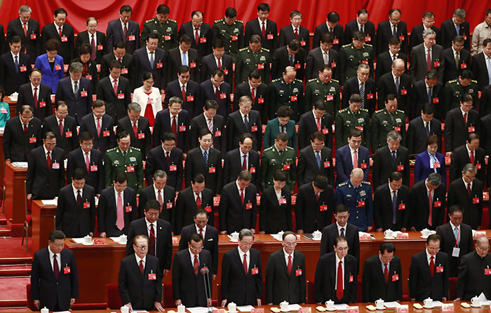 epa06272621 Chinese President Xi Jinping (front L), former president Jiang Zemin (front 2-L), Premier Li Keqiang (front 3-L) and delegates stand in silence for a minute to commemorate past revolutionaries during the opening ceremony of the 19th National Congress of the Communist Party of China (CPC) at the Great Hall of the People (GHOP) in Beijing, China, 18 October 2017. China holds the 19th Congress of the Communist Party of China, the country's most important political event where the party's leadership is chosen and plans are made for the next five years. Xi Jinping is expected to remain as the General Secretary of the Communist Party of China for another five-year term. EPA/HOW HWEE YOUNG